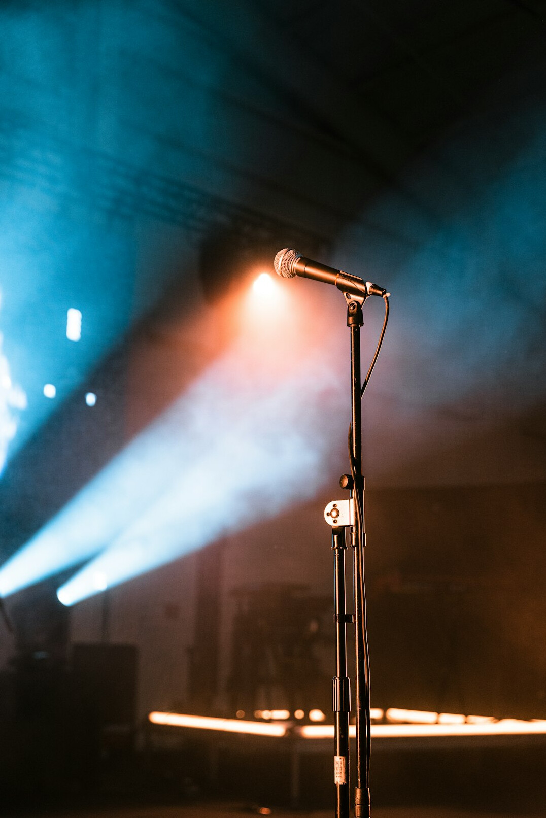 speaker on stage with microphone