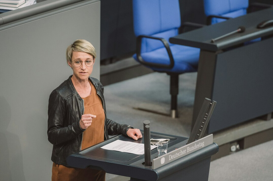 confident german public speaker on stage