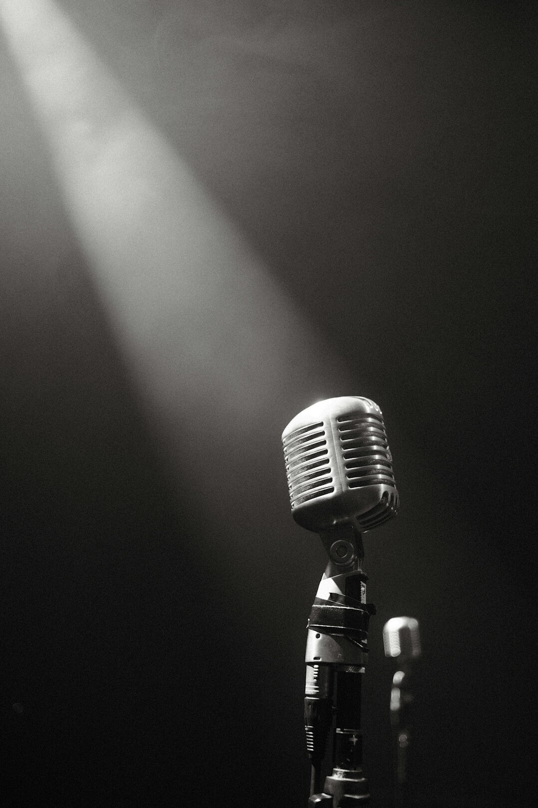 speaker on stage with microphone